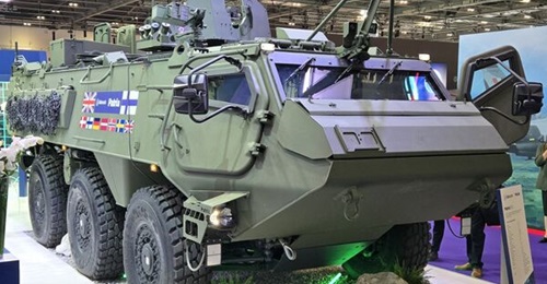A Patria 6×6 armoured personnel carrier platform displayed at DSEI 2025.