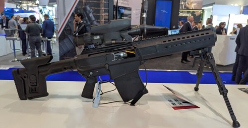 A Barrett Firearms' Squad Support Rifle System prototype with Precision Targeting LLC fire control system, displayed at DSEI 2025.