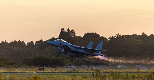 A JASDF Boeing (Mitsubushi) F-15J Eagle aircraft of the 305th Tactical Fighter Squadron takes off from JASDF Nyutabaru Air Base in Japan in 2024 to participate in a bilateral exercise with US forces.