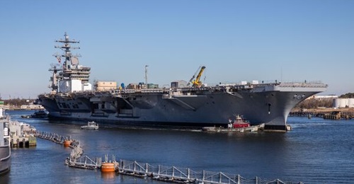 Norfolk Naval Shipyard is looking to reduce the time it takes to finish work on carrier USS 
        
        shown here, entering the yard.