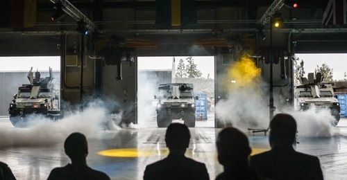The first three BvS10s (from left to right, the first German, Swedish, and UK vehicles) were rolled out at BAE Systems Hägglunds in Örnsköldsvik, Sweden, on 16 September 2025.