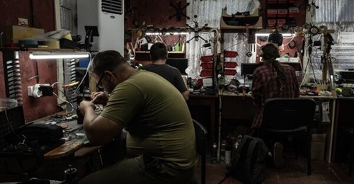 Repair and solder works on first-person view unmanned aerial vehicles being conducted in a workshop in Ukraine's Donetsk oblast on 12 September 2025.