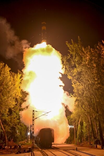 India's medium-range Agni-Prime missile is seen fired from a rail-based mobile launcher system.