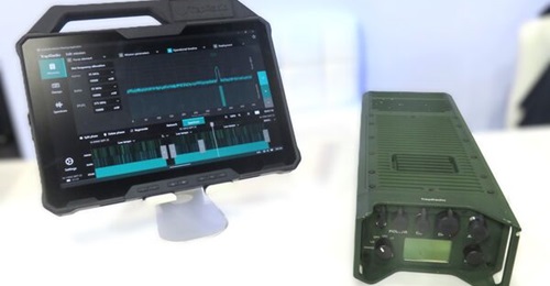 The TrapRadio transmitter (right) and mission planning application (left) hosted on a tablet displayed at DSEI 2025. Note the three different nets on different frequencies being generated by the system.