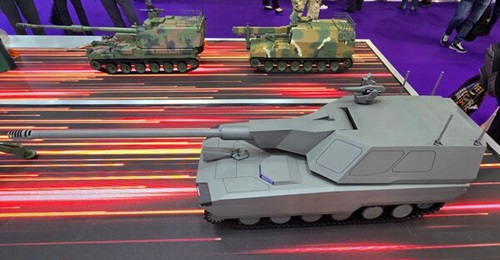 A model of Hanwha's future K9A3 SPH (front right) and a K9A2 model with full autoloader and improved gun (back left) displayed at DSEI 2025 in September.