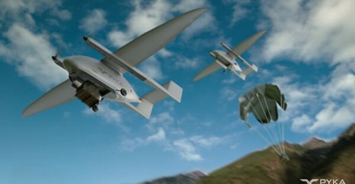 A rendering of Pyka DropShip UAVs conducting an airdrop mission.