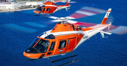 A US Navy and Marine Corps TH-73 training helicopter in flight.