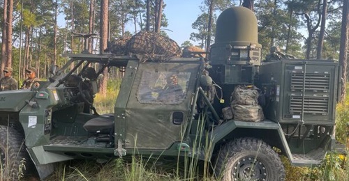 An Infantry Squad Vehicle carries a Tactical Electronic Warfare System-Infantry during the 101st Airborne Division training rotation at Fort Johnson, Louisiana.