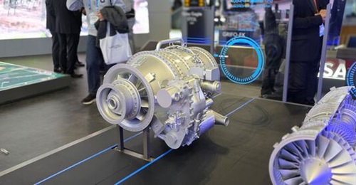 Hanwha's new 1,400 shp engine - a 1:1 scale model of which is seen in the centre of the image above - is being developed for the MUAV Block II.
