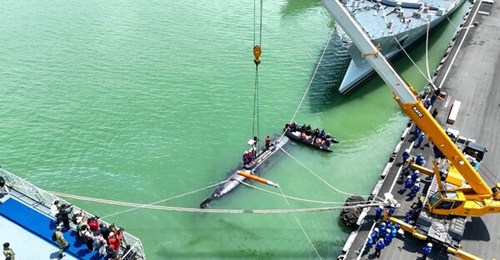 Indonesia's KSOT seen here loading a torpedo round ahead of its inaugural firing exercise.