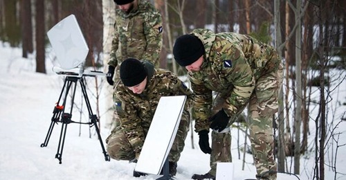 British soldiers during Operation 'Clockwork' in Bardufoss, Norway, on 26 February 2025 set up portable internet/WiFi satellite communications equipment.