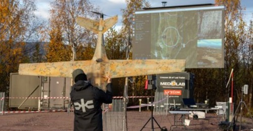 A UAV operator from Six Robotics preparing to launch SkyRobot FX10NG VTOL.