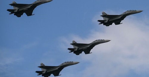 Russian-made Venezuelan Air Force Sukhoi Su-30MKV multirole strike fighters overfly a military parade to celebrate Venezuela's 211th anniversary of its independence in Caracas on 5 July 2022.