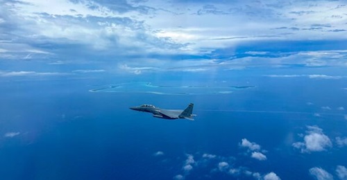 A USAF Boeing F-15E Strike Eagle assigned to the 336th EFS conducts a mission near Diego Garcia atoll (British Indian Ocean Territory) in July 2025.