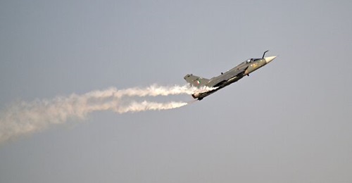 This picture taken on 20 November 2025 shows an IAF HAL Tejas Mk 1 performing an aerial display flight at Al Maktoum International Airport during the Dubai Airshow 2025.