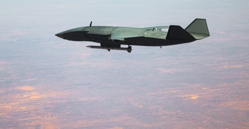An MQ-28A Ghost Bat carries an AIM-120 AMRAAM on 8 December 2025, during Trial Kareela 25-4 at RAAF Base Woomera, South Australia.