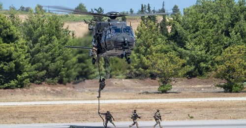 A Hellenic Army NH90 TTH helicopter fast-roping troops. Greece ordered 20 such helicopters in 2003, with deliveries running from 2011 to 2025.