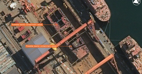 Vantor imagery showing a possible nuclear-powered aircraft carrier (CVN) under construction in a dry dock at Dalian in China. Two possible reactor containment vessels are visible.