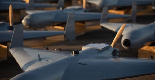 A Low-cost Unmanned Combat Attack System one-way attack drone, like those shown here on a tarmac at a US Central Command base, was launched from a littoral combat ship.