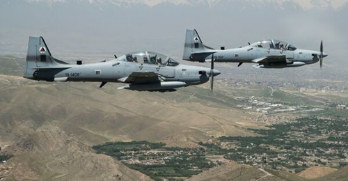 A two-ship formation of A-29 Super Tucanos fly over Kabul, Afghanistan, during a mission on 28 April 2016. Embraer is working on giving the aircraft C-UAS capabilities.