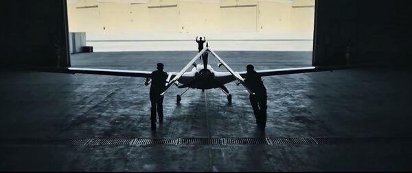 A still from a video published by UAE's Edge Group showing military personnel pushing what appears to be a Bayraktar TB2 UAV out of a hangar, probably at Liwa Air Base.