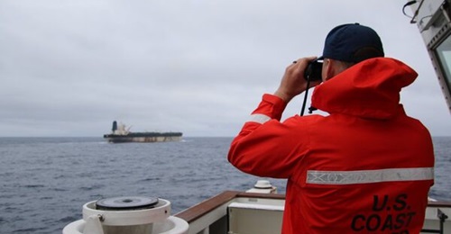 US Coast Guard personnel watch the Russian-flagged tanker Marinera in a photo released on 7 January 2026, as US forces seized the vessel.