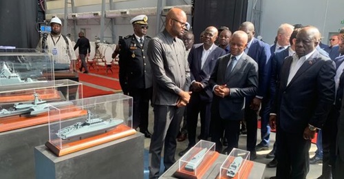 General Francisco Furtado (hands clasped) looks at models of CMN vessels during the inauguration at the Lobinave shipyard in Lobito.