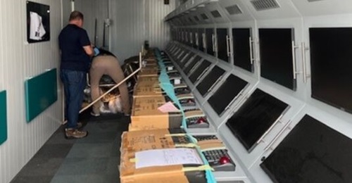 A photo published by the US DoJ on 15 January 2026 showing what the DoJ called mission crew trainers seized inside a shipping container.