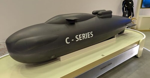 A 1:5 scale model of M23's C-Series mini-submarine, usually 22 m long, displayed at DIMDEX in January 2026.