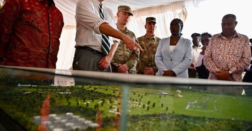 US Deputy Secretary of State Christopher Landau points at a model showing the Manda Bay airfield expansion project.