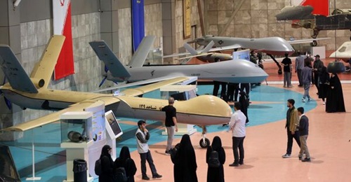 The Shahed-139 is seen behind a Shahed-129 at the IRGC Aerospace Force's permanent exhibition in Tehran, with a recovered US Air Force MQ-1 Predator in the background.
