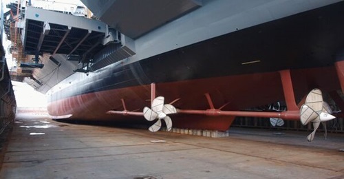 Aircraft carrier 
        
        , shown here under construction, completed builder's trials.