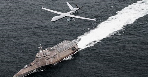 An MQ-9 is shown here operating with a littoral combat ship. The US Navy's new Fighting Instructions detail a future force combining disparate platforms.