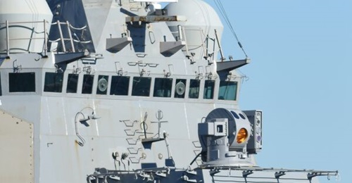 The US Navy is looking to accelerate the development of laser weapons like the HELIOS system shown here on USS 
        
        .