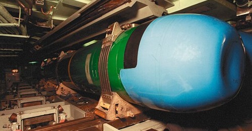 A MK 48 Advanced Capacity (ADCAP) torpedo in a storage rack in the torpedo room of the nuclear-powered attack submarine USS 
        
         (SSN-758). A MK 48 ADCAP heavyweight torpedo strapped down in USS 
        
         weapons compartment.