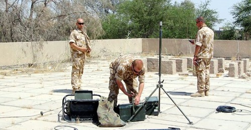 British troops setting up HALO post, also known as Advanced Sound ranging Programme (ASP) sensor in UK service, at a rooftop location in Iraq.