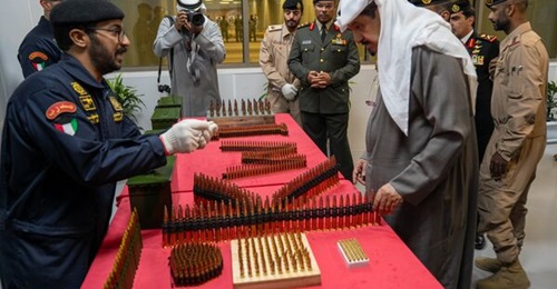 Kuwaiti Prime Minister Sheikh Ahmed inspects ammunition during the inauguration of the Naif Light Ammunition Factory.