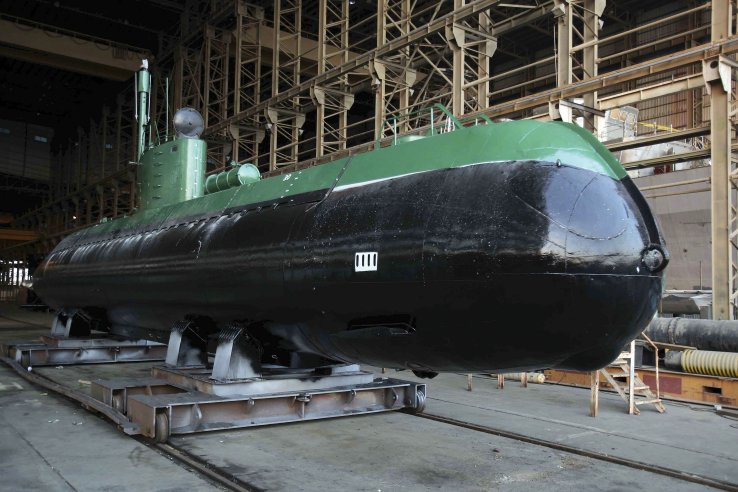 A Ghadir submarine is seen out of the water. It is unclear if the submarine-launched missile is a short-range weapon developed for the class or whether one of the midgets is being used as a test platform for a missile designed for the new Fateh class. (Iranian Ministry of Defence and Armed Forces Logistics )