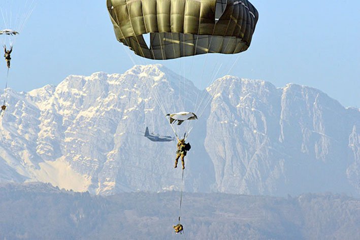 US Army paratroopers descend onto Juliet Drop Zone, Pordenone, Italy, in February 2019. The service is working to include foreign partner and ally input into its modernsation plans and working through some interoperability challenges. (US Army)