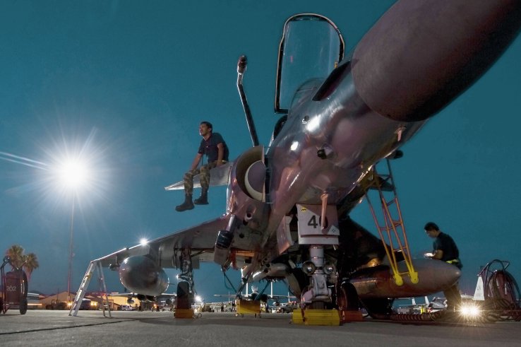 A Colombian air force technician sits on the canard of a Kfir during a ‘Red Flag’ exercise in 2012. IAI hopes to sell the enhanced Kfir NG to Colombia, and expects to return to service aircraft for Sri Lanka and Ecuador. (US Air Force)