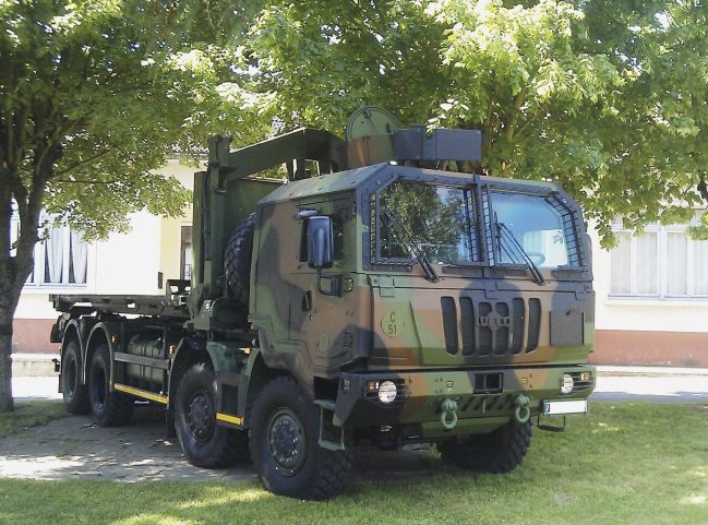 One of the latest trucks to enter service with the French Army is this Iveco Defence Vehicles 8×8 fitted with a protected cab and a mechanical handing system at the rear.  (Section Technique de l’Armee de Terre)