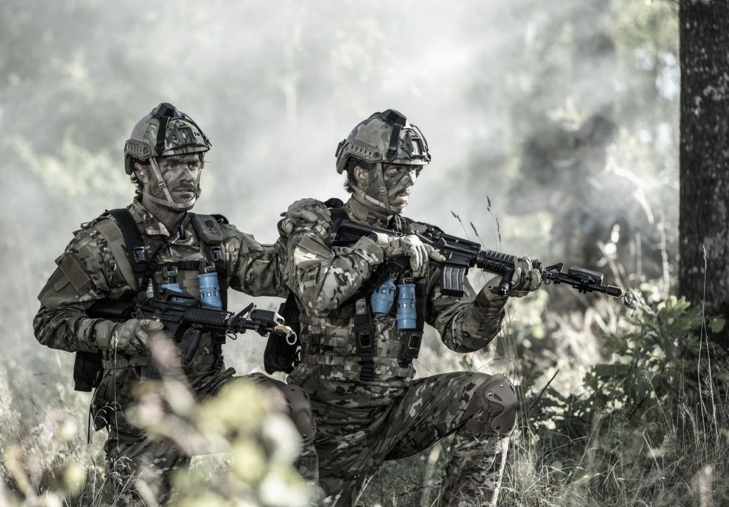 Saab is to provide infantry equipment as part of its contract to supply a complete CTC system to the Belgian Army. The personal detector device includes the harness with laser detectors, a 360° detector on the top of the helmet connected by an inductive link to the harness, and a control unit (seen on the left shoulder of the individual on the left). The BT47 small-arms laser transmitters are the small boxes mounted on the weapon barrel in front of the foresight. (Saab Training & Simulation)