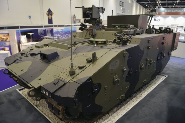 The Athena C2 variant of the Ajax AFV family. It can be distinguished from the Ares APC by the raised superstructure and large box on the roof of the vehicle. (IHS Markit/Patrick Allen )