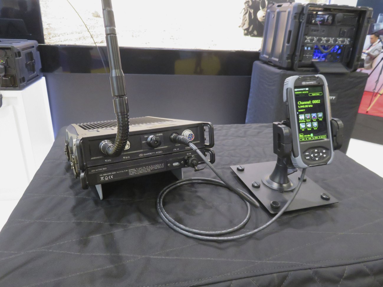 The Barrett PRC-4090 as shown at DSEI 2019 in the manpack configuration. The transceiver is mounted above the battery pack, with the control handset to the right. (Giles Ebbutt)