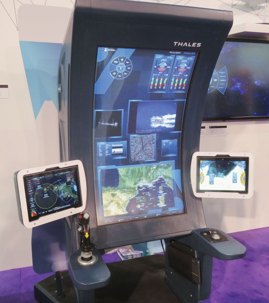 Pictured here is the Thales Mission@ISR concept demonstrator displayed at DSEI 2019. On the single curved screen from the top are: circular menu; mission data for two UAVs; two electro-optical sensor feeds; AIS track data; overhead imagery; and overall tactical picture. (Giles Ebbutt)