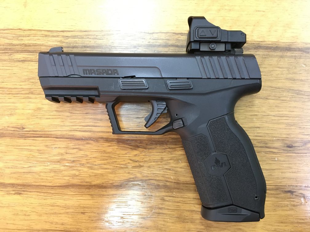 IWI’s 9 mm Masada pistol, shown with a Meprolight red-dot sight. (IHS Markit/Dan Wasserbly)