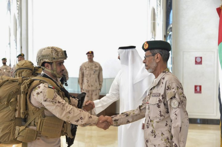 Lieutenant General Hamad Mohammed Thani al-Rumaithi, chief of staff of the UAE Armed Forces, shakes the hand of a soldier returning from Yemen. (WAM)