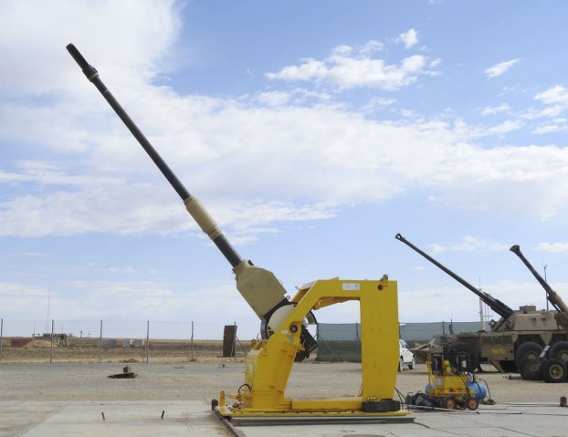 A G6 self-propelled howitzer with a 52-calibre gun (background) achieved the longest range ever attained with a conventional 155mm artillery round by firing it 76 km, while a PzH 2000 52-calibre gun (foreground) fired a shell 67 km at the Alkantpan test range in South Africa on 6 November. (Rheinmetall)