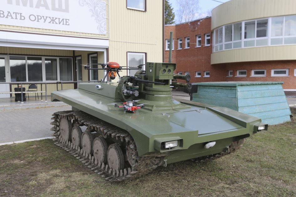 The updated Marker unmanned ground vehicle seen with quadcopter UAVs.  (FPI)