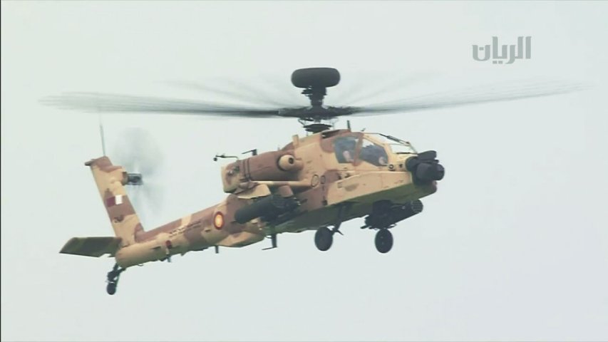 An QEAF Apache Guardian is seen in a still from Qatari TV coverage of the parade. (Al-Rayyan TV)